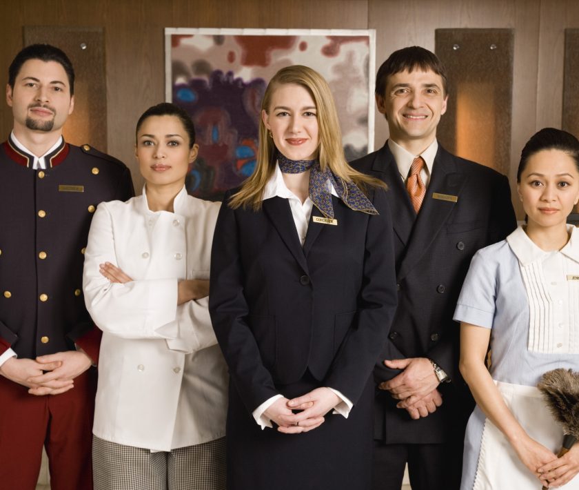 Hospitality professionals standing together as a team